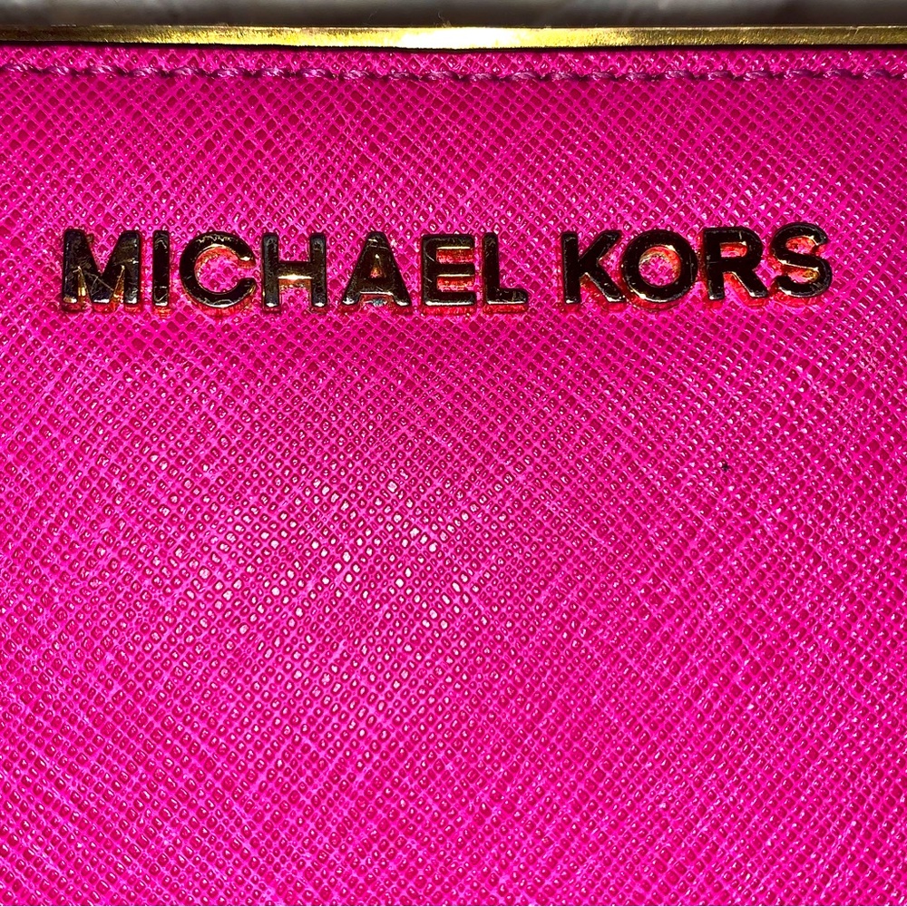 Hot pink Michael kors wallet with flaws